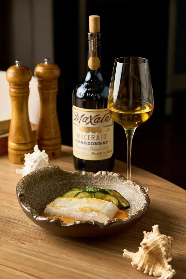Fish dish with a bottle of white wine