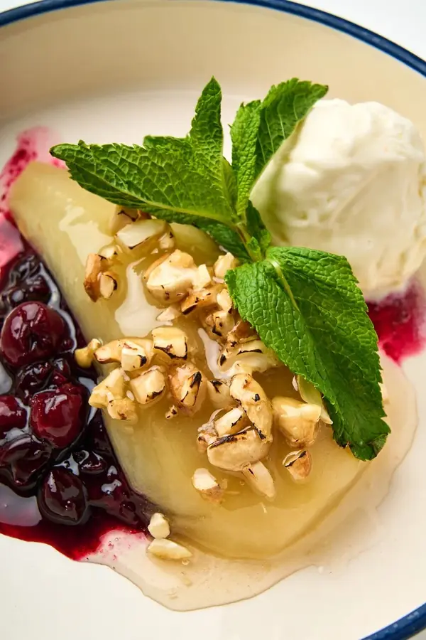 Poached pear dessert with berries