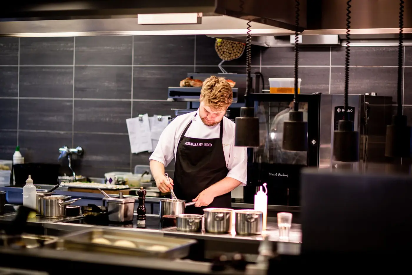 A cook working on the kitchen line